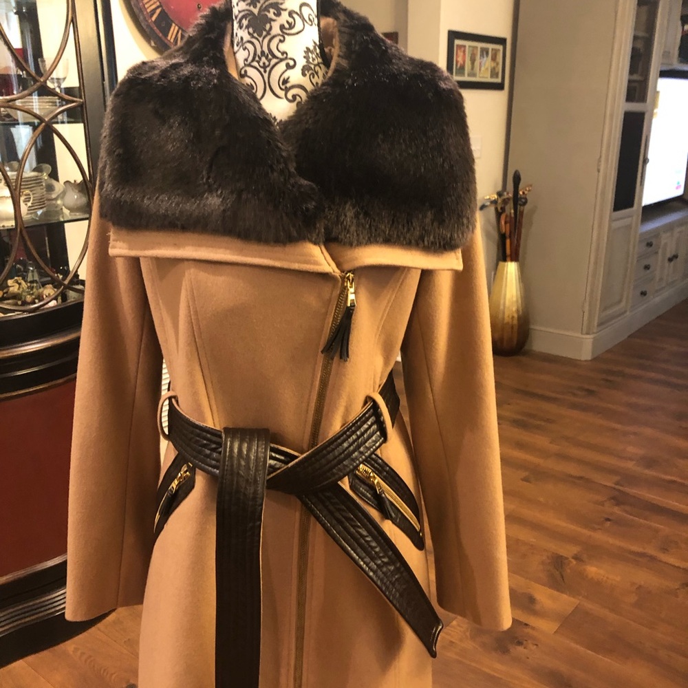 3/4 length camel zipper and belted coat with faux fur trim.